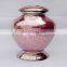 pink coloured shiny finished metal urns