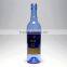 Blue clear glass wine bottle witn long neck beer bottle