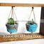 Wooden frame swings concrete planters