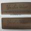 Custom faux leather garment leather labels with little holes