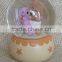 Hot sale eco-friendly warm color baby series snow globes wholesale