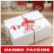 christmas cardboard gift box with red ribbon bow