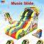 Patented Crazy misic theme giant Commercial tobo gay cartoon inflatable double lane slip slide for sale with CE approved