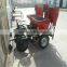 Big tractor with four row potato planter