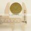 yellow metal shank button with patterns