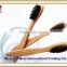 Family toothbrush with long thin bamboo handle and black soft bristle