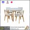 white solid wooden round dining table