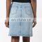 Light indigo cotton embroidered denim skirt from W.W.S. featuring a five pocket design
