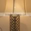 Moroccan brass table lamp with pierced lampstand and beige drum fabric shade for villa decoration