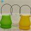 Hanging candle containers with scented candles