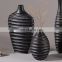 Support customized wholesale cheap unique handmade design black wine bottle shape resin vase