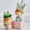 Hot green plant decorated cartoon boy resin flowerpot decoration