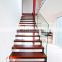 Frameless glass balustrade and zig-zag steel stringer stairs