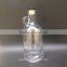 clear glass beer growler wine bottle