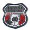 laser cut shield shape iron on woven badge for USA polo shirt
