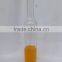 cylinder shaped clear glass vodka bottle with cork stoppers
