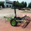 Grass mower with rake