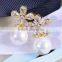 Women 's gold plated flower rhinestone pearl earrings