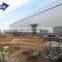 Qingdao prefabricated curved steel fabrication insulated auto workshop layout building