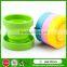 Heat resistant collapsible double wall glass cup with silicone lid