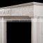 white marble fireplace with flower frame