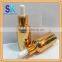 wholesale golden glass cosmetic bottle with pump