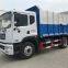 Hook arm garbage truck