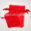 red scented sachet with ribbon drawstring