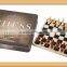 wooden chess set in tin box