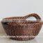 Small round rattan basket with handles