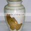 Brass Praying Hand Cremation urns.