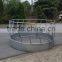 Round bale hay feeder for cattle and horse
