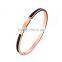 Rose gold plated with black enamel stainless steel bangle with engrave logo