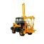 Pile driver for highway guardrail post ramming, drilling and extracting
