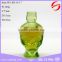 green skull shape glass bottle for perfume