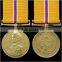 Round commemorative metal medal on Webbing