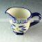 China factory unique shaped ceramic cup with handle, cheap stock porcelain cup for wholesale