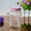 Transparent mason jar glass mug with lid and straw