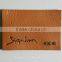 Embossed trademark genuine leather label in apparel