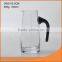 glass wine decanter with colored glass handle and scale