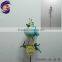 Shining metal bird standing on stick with metal garden decorative windmill