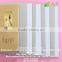 Uncoated white/pink laminated grey board