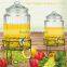 Transparent glass beverage jar with metal stand
