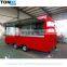 A mobile food trailer capable of producing hot dogs and barbecues.