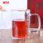 Hand made high borosilicate glass dual cup with handle wholesale