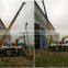 Pile auger drill machine with crane for pole erection