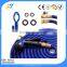 Watering expandable spring garden hose with spray nozzle