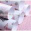 Ivory plastic gift wrapping paper roll