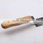 Tooth shaped uncapping knife with knife toe turning up
