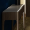 Hotel table with stone top and metal base